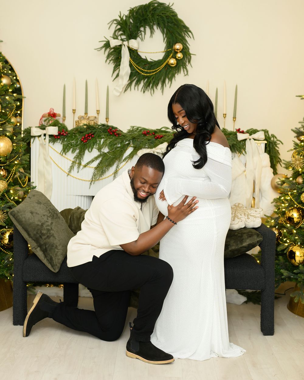 A couple in formal attire shares a tender moment in front of a decorated Christmas tree and holiday decor.