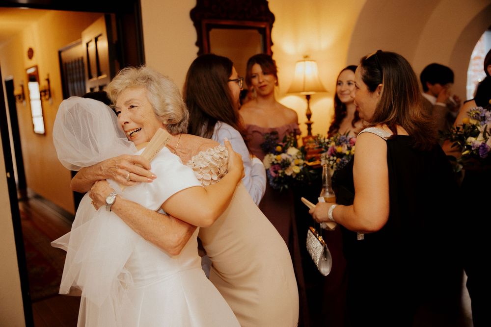 Warm-toned candid moments of celebration at an evening wedding reception.