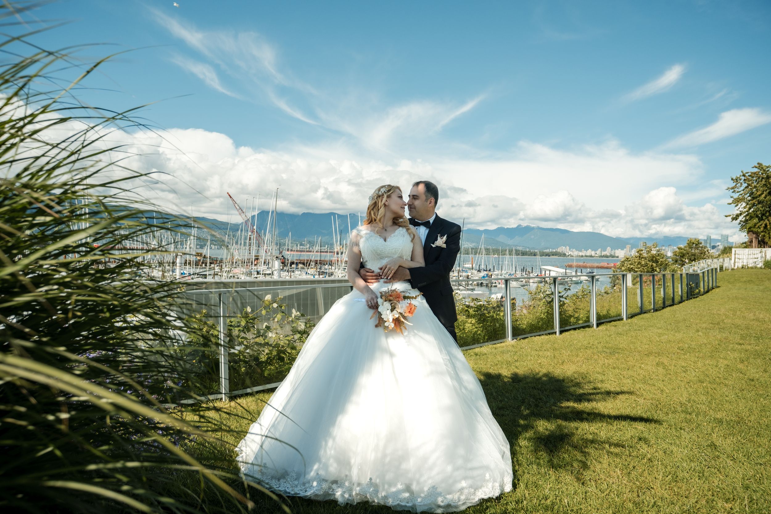 Scenic outdoor wedding photography session with Diamond Head crater and Honolulu cityscape views in the background.