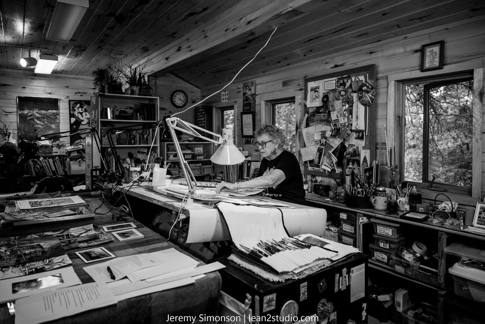Black and white photo series showing various workbenches and workshop spaces with tools and equipment.