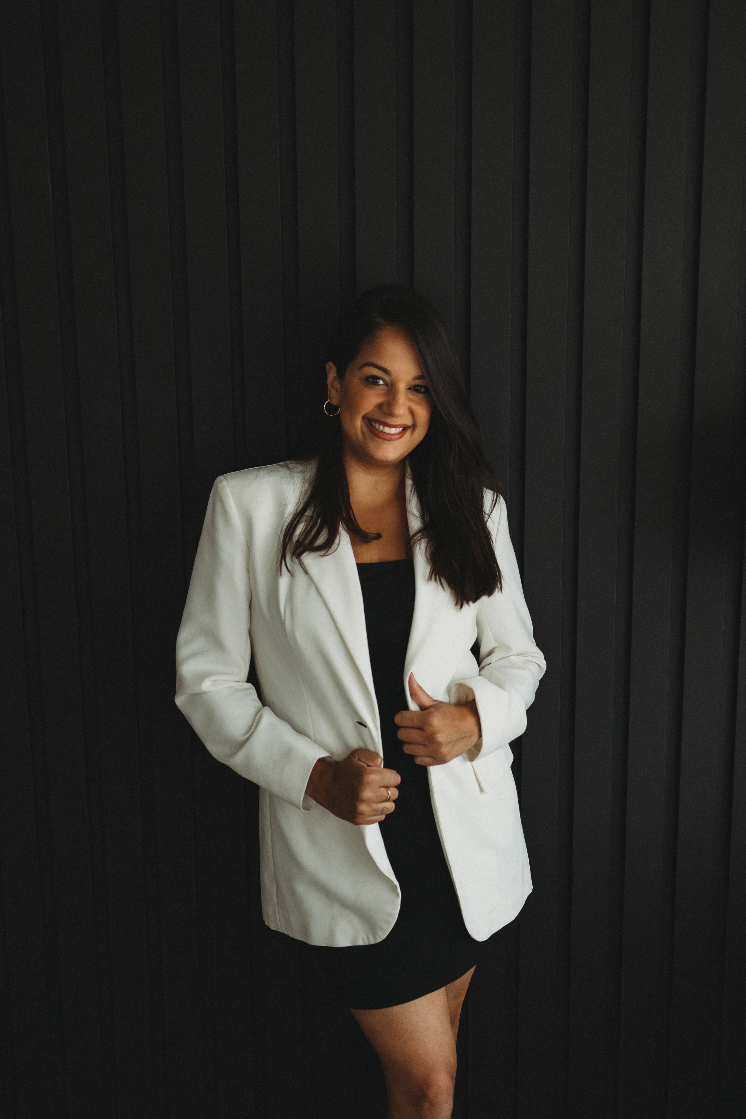 Professional portrait series showing a person in a white blazer against a dark background.