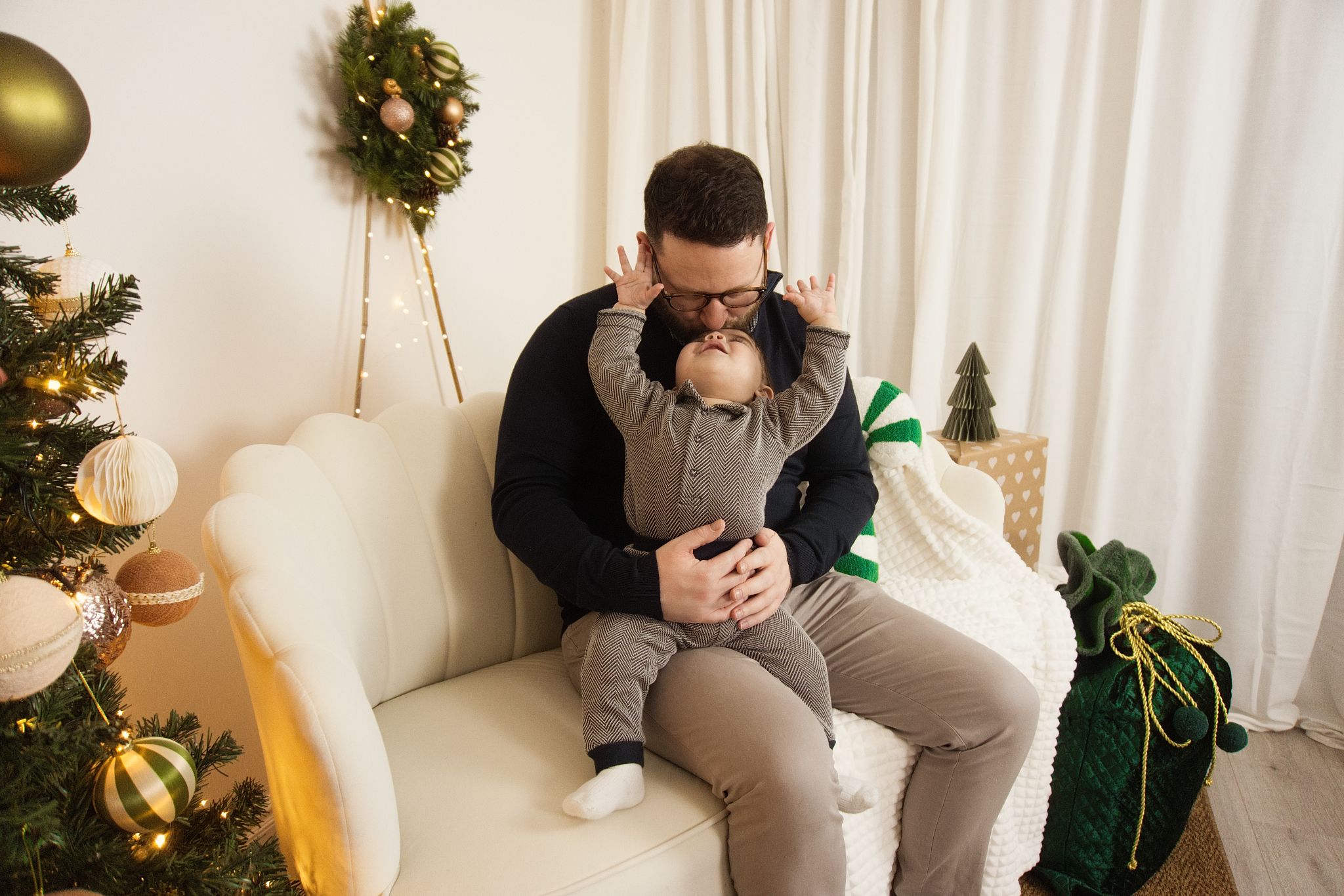 A family Christmas photo in a warm setting.