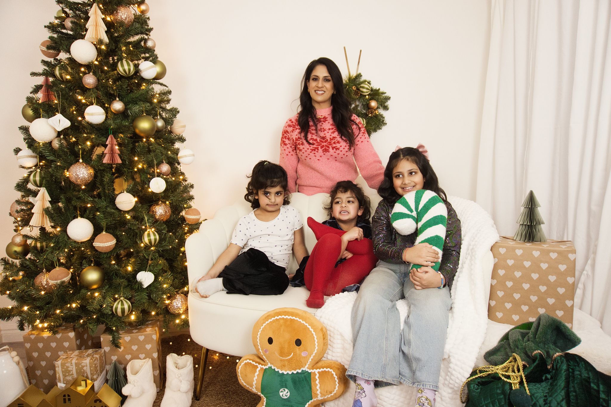 A family Christmas photo in a warm setting.