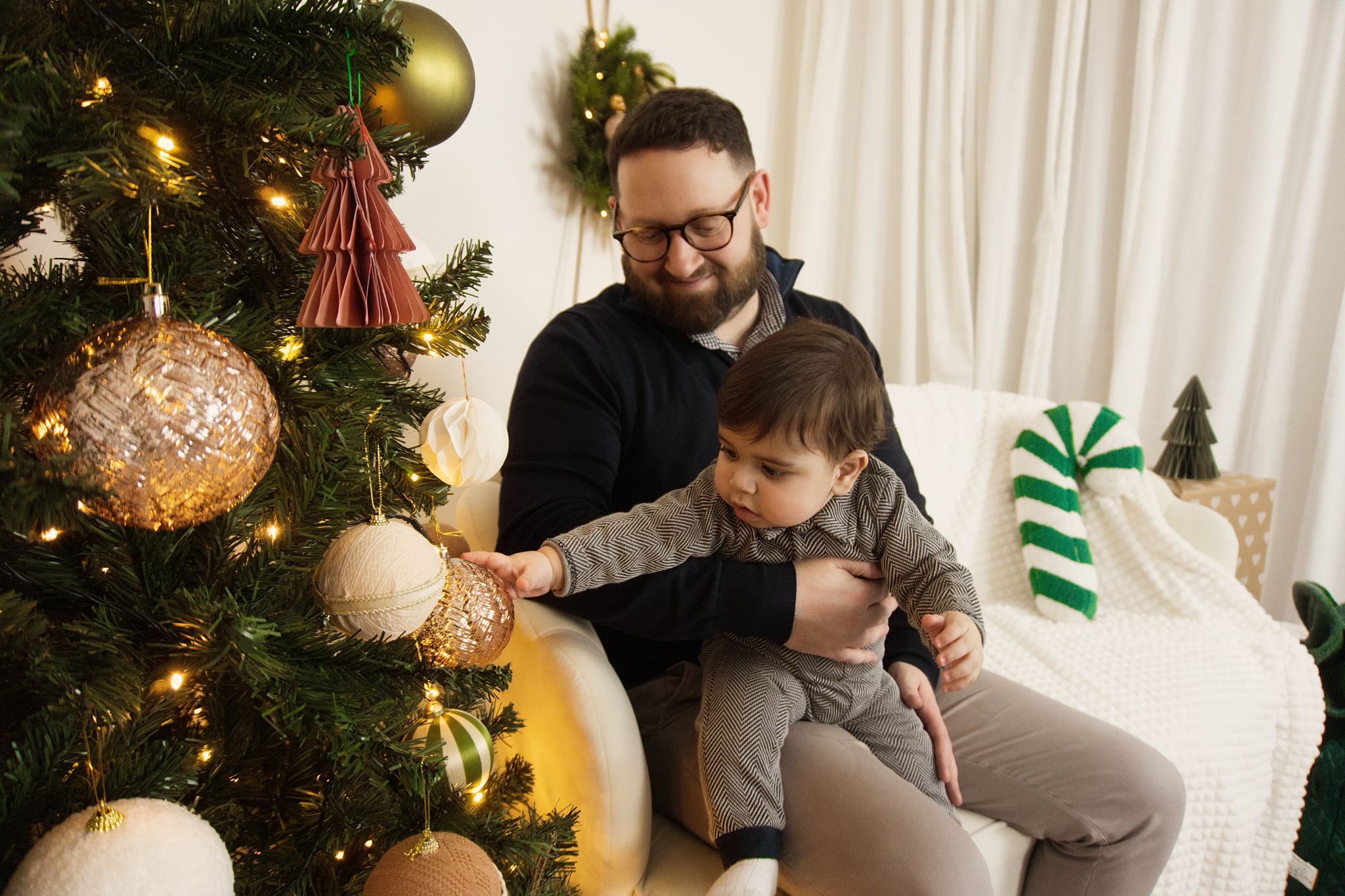 A family Christmas photo in a warm setting.