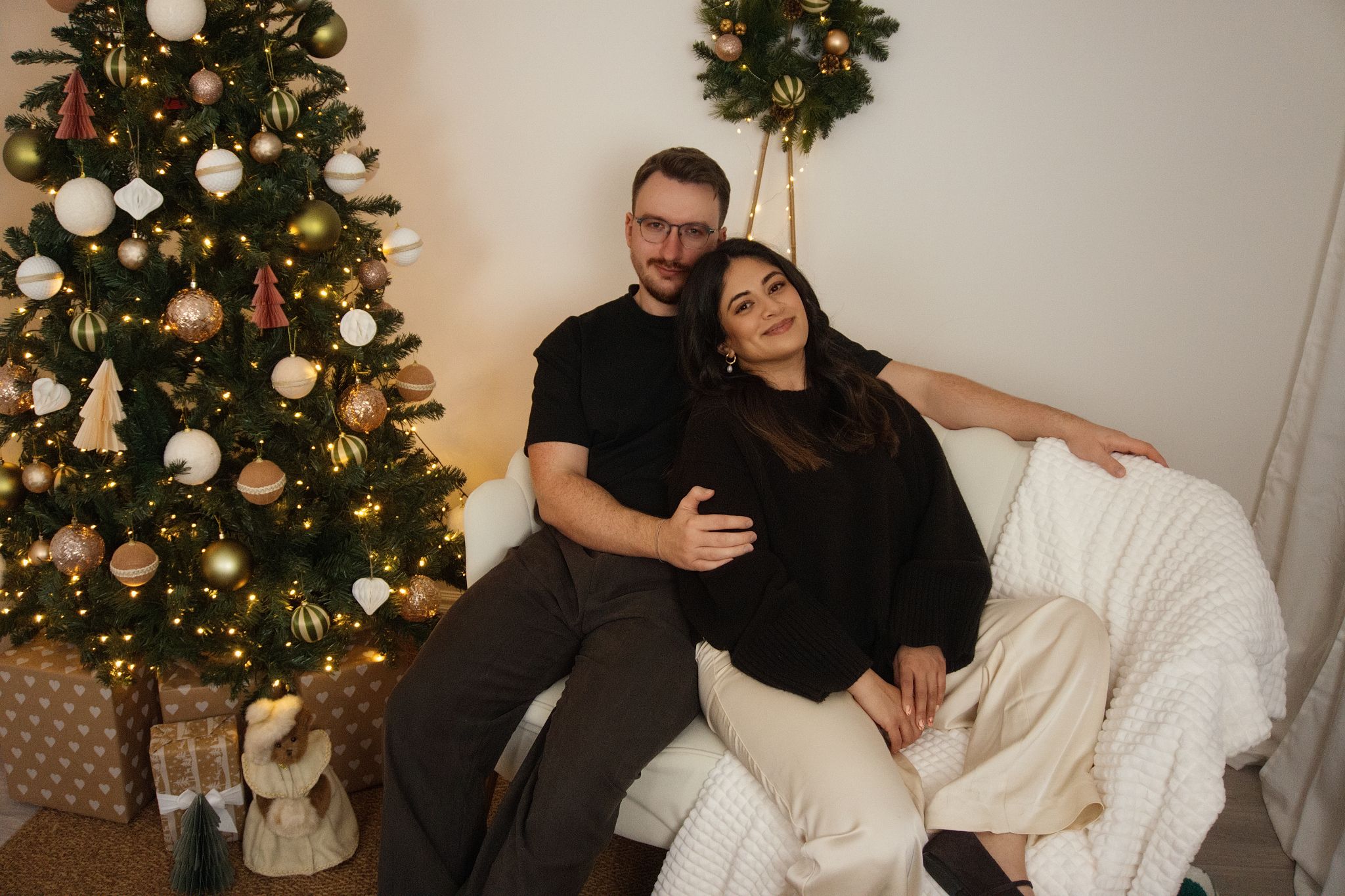 A family Christmas photo in a warm setting.