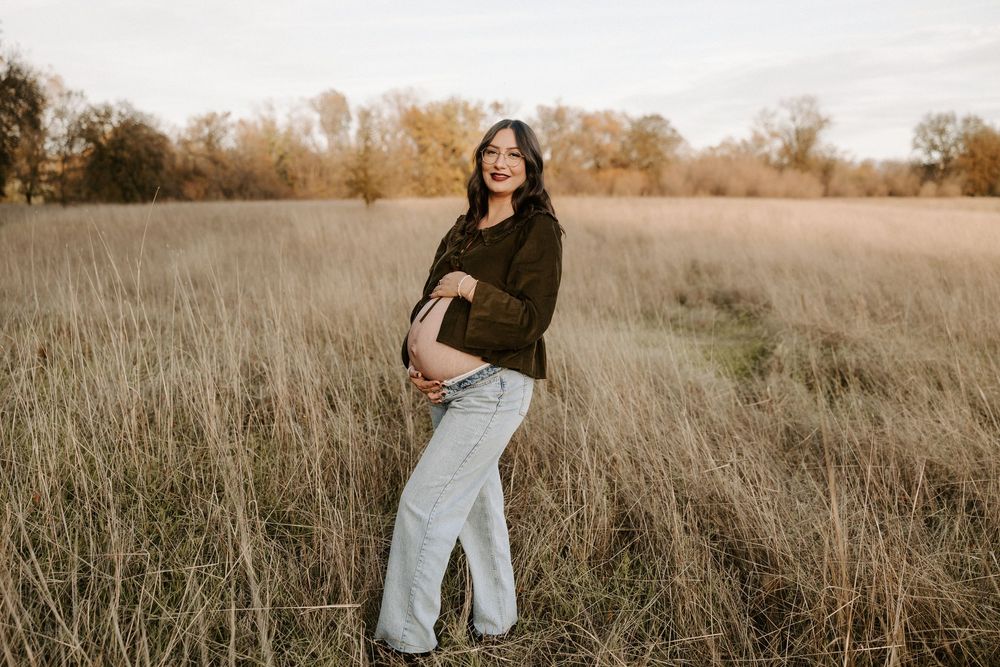 A series of candid portraits in a golden autumn field with tall grass during sunset.