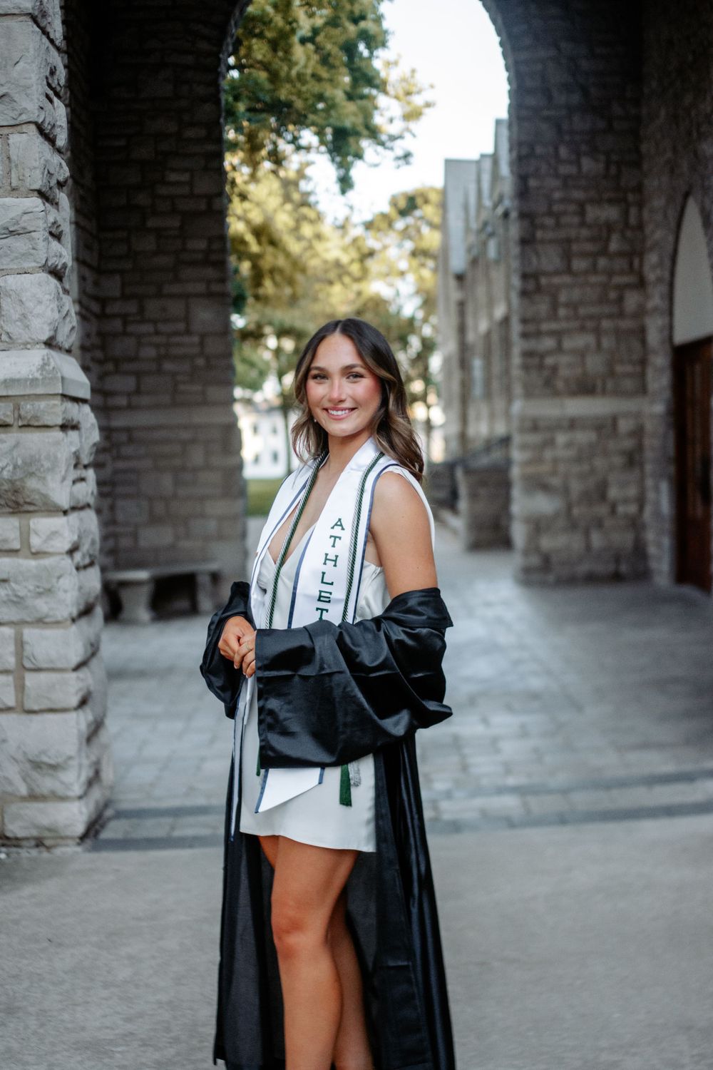 Graduation photos of a client in cap and gown at Central Methodist University, capturing a proud academic milestone.