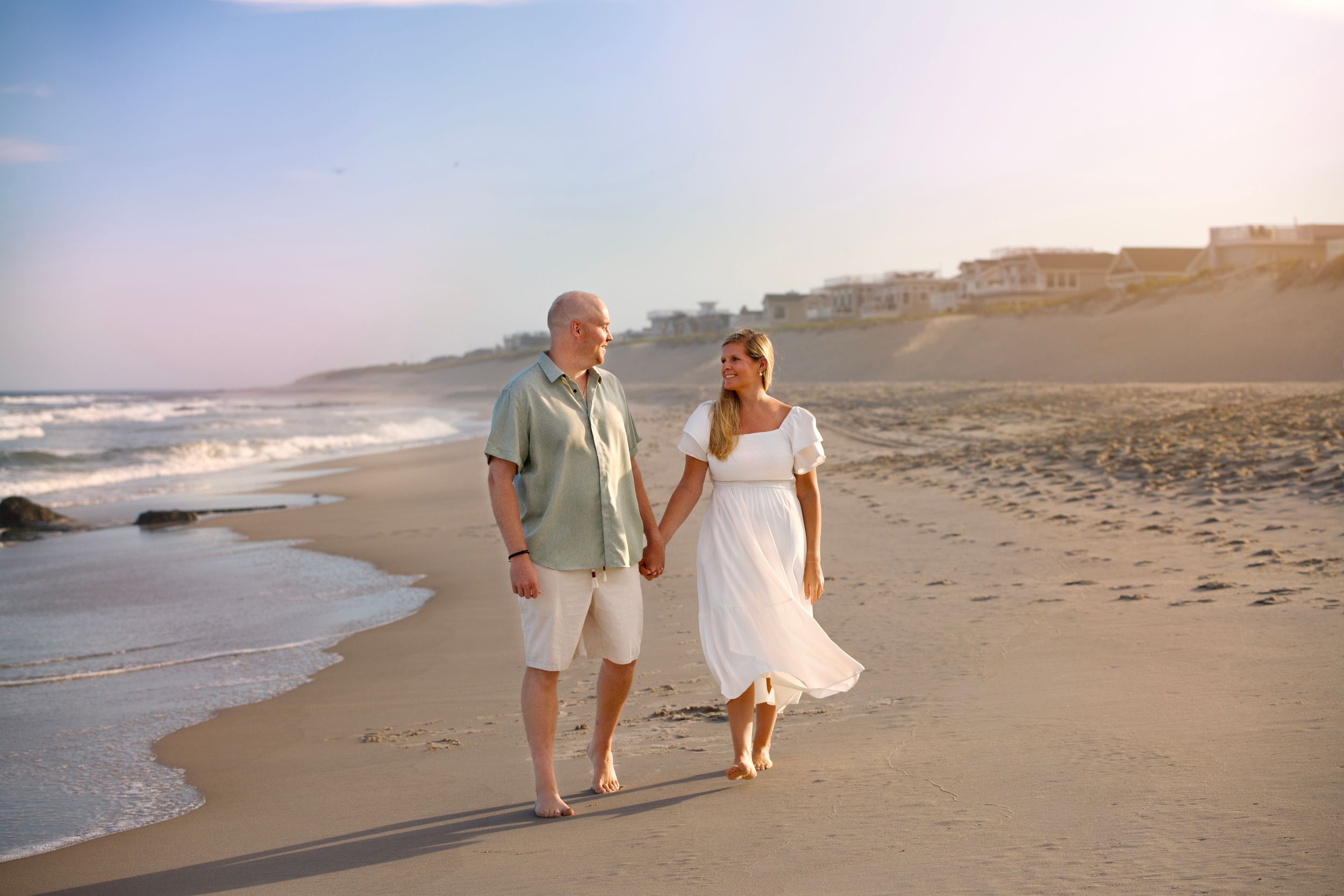 Bergen-County-Family-Photographer and LBI Family Photographer captures engaged couple walking hand in hand