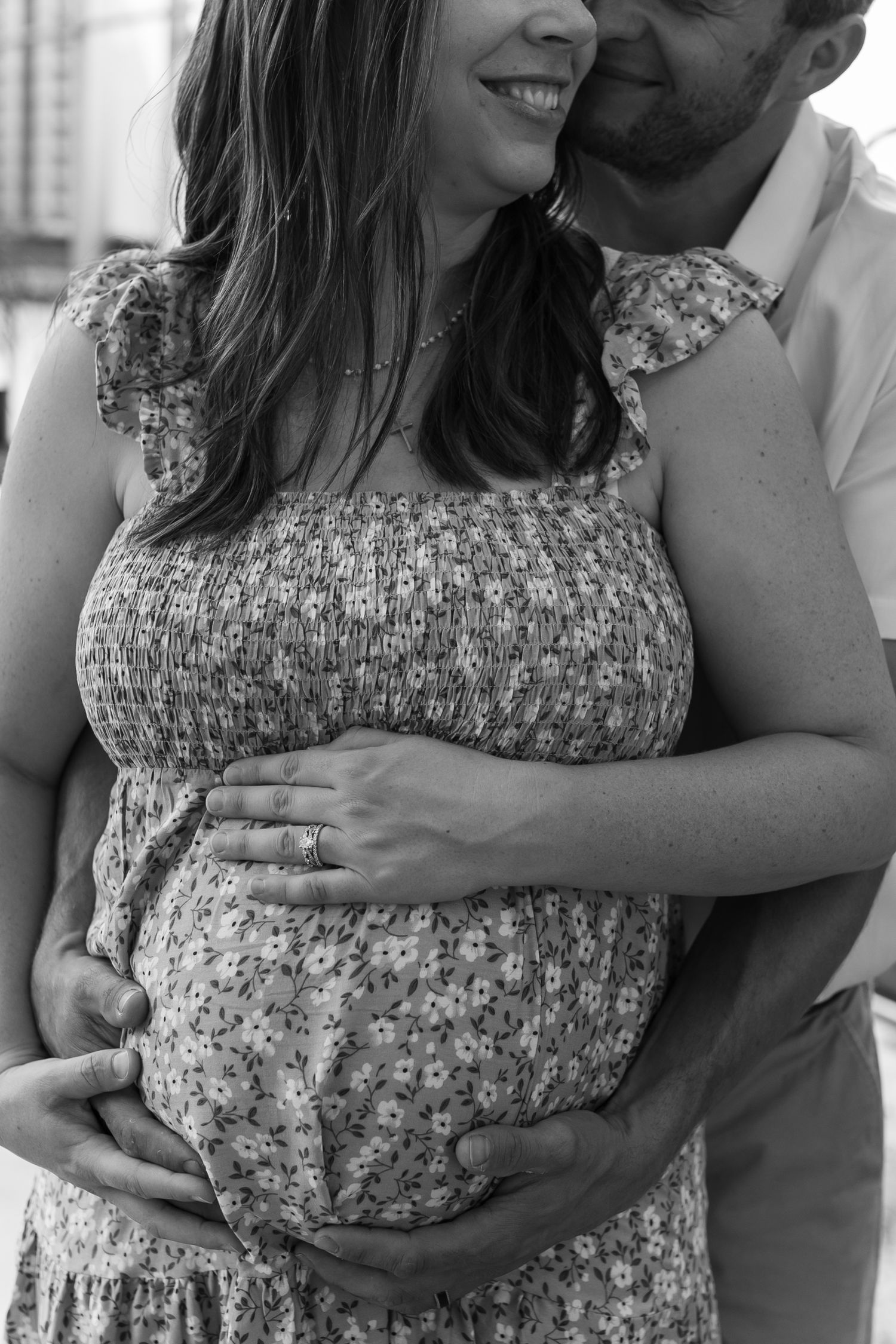 Black and white series of intimate maternity photos showing tender embraces.
