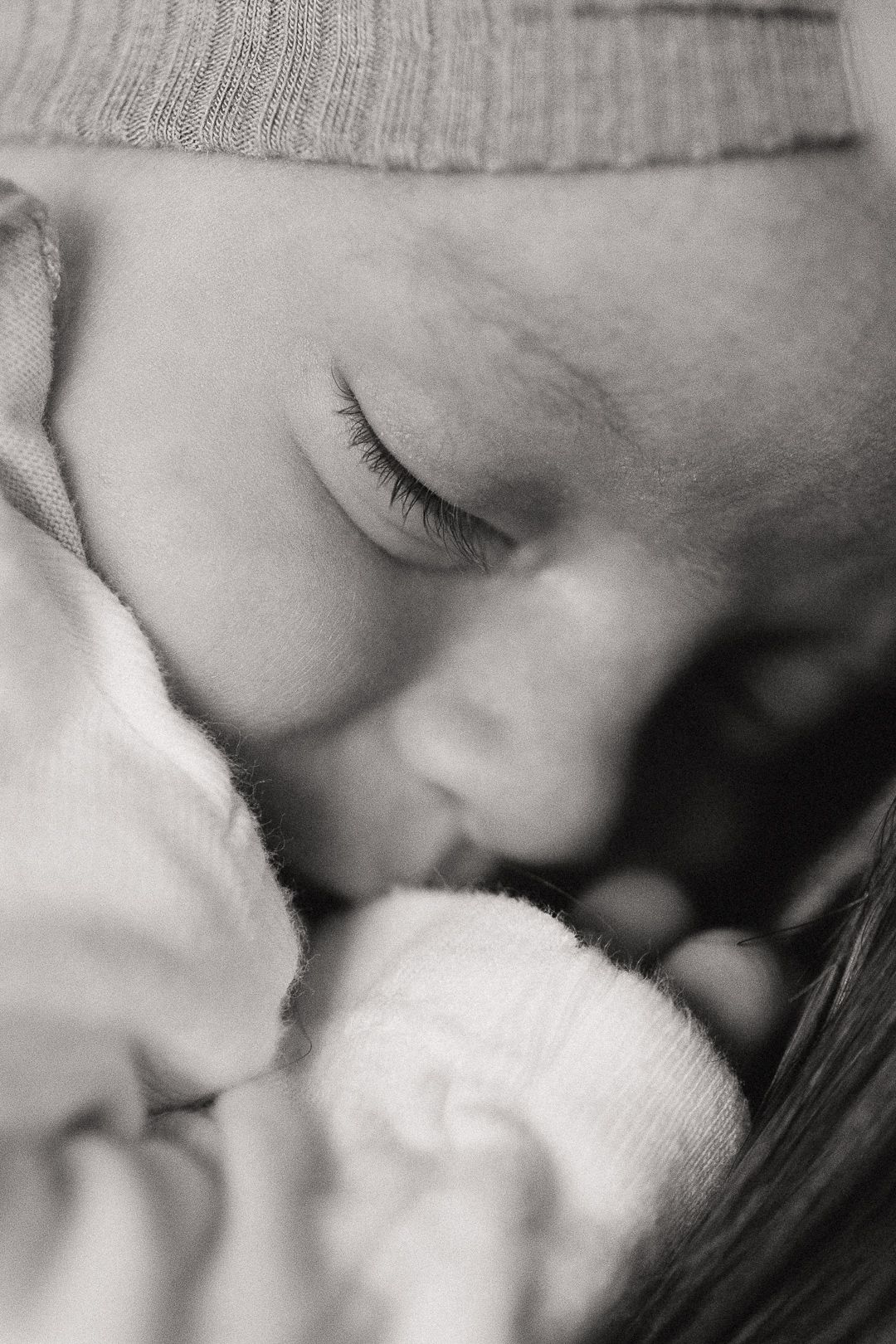 Intimate black and white macro photograph showing soft textures and gentle shadows.