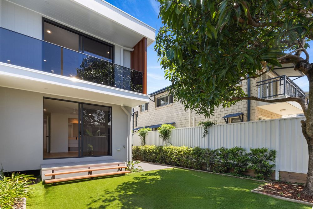 Exterior view of a contemporary home with landscaped garden and clean architectural lines.