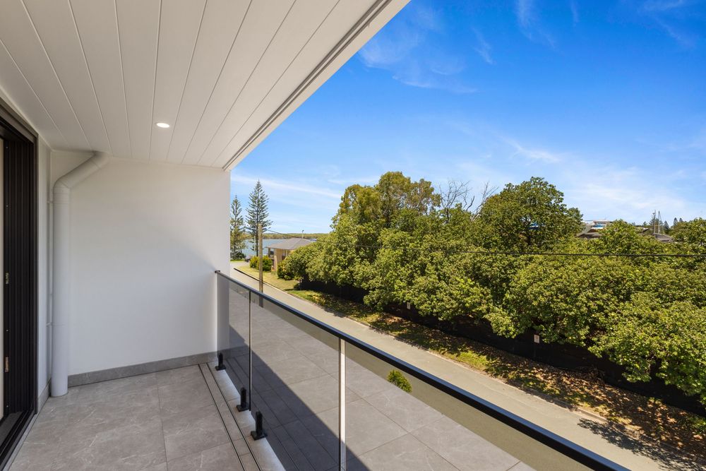 Outdoor terrace with panoramic views and white ceiling detail.