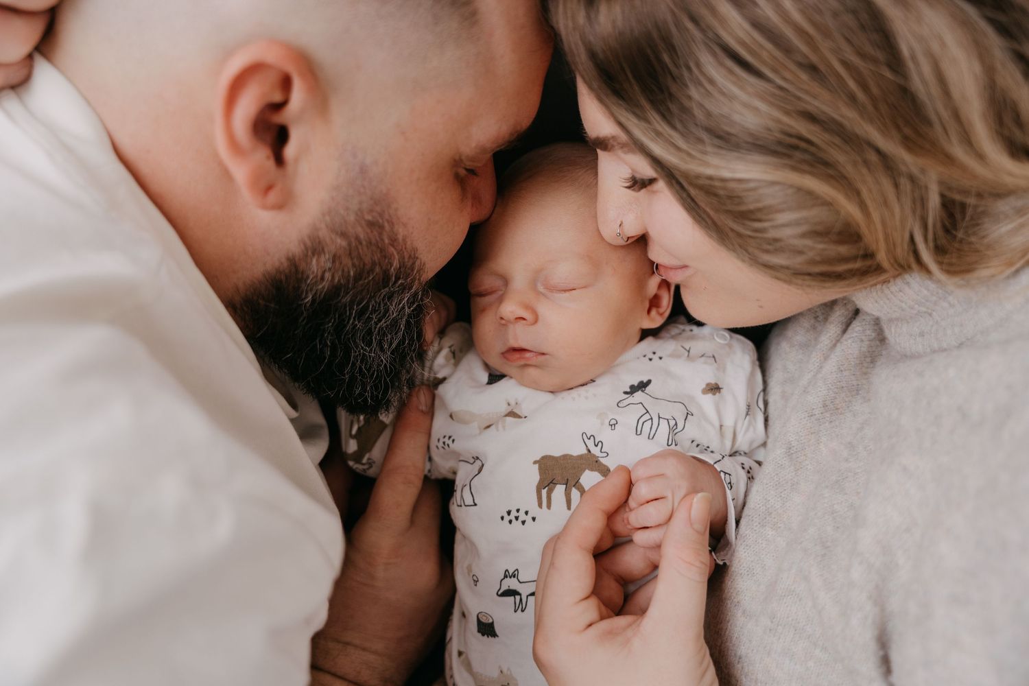 A collection of tender family moments captured in soft, intimate photographs showing parents with their baby.