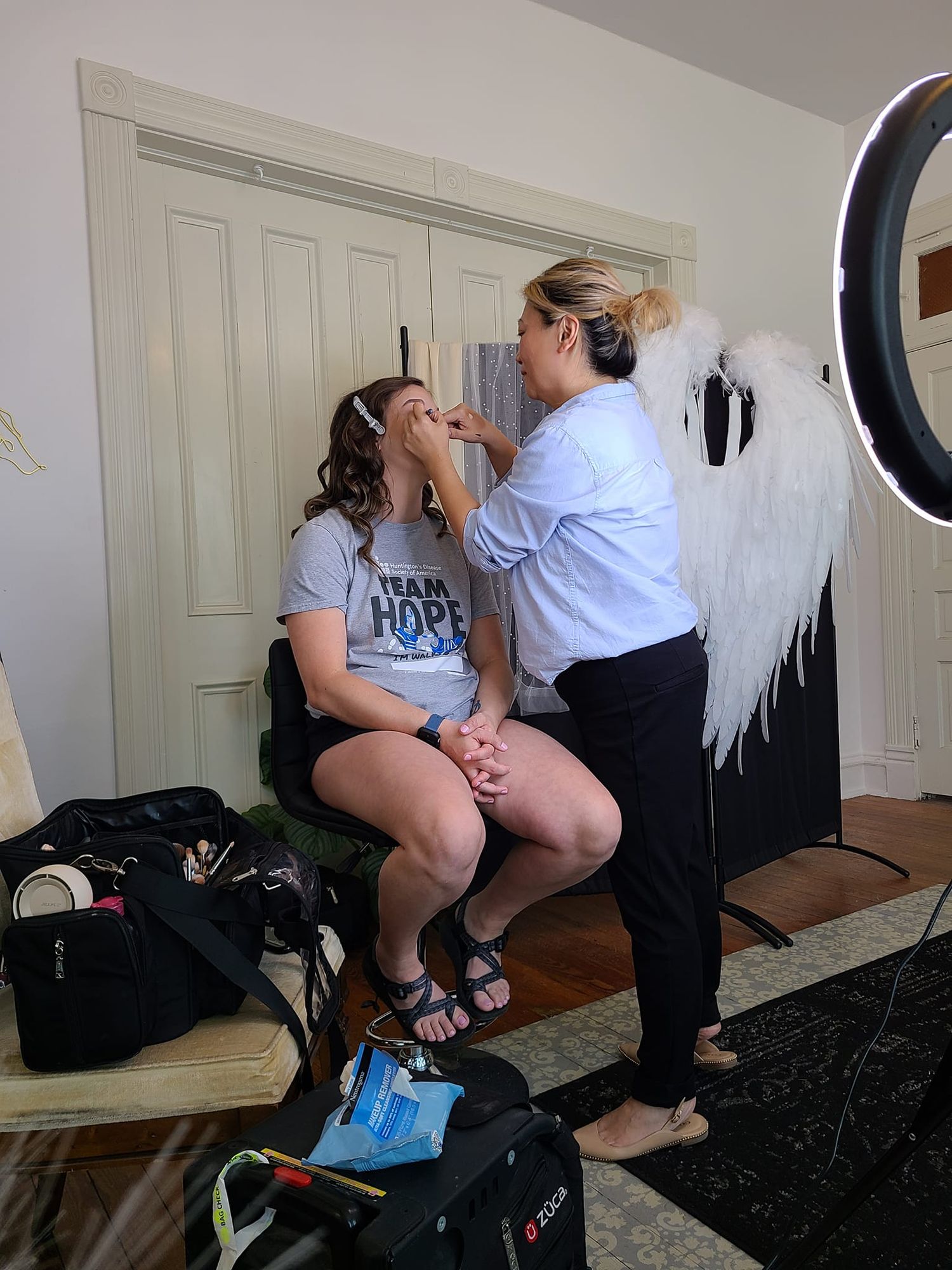 A client before her boudoir session getting her makeup done in a Cape Girardeau Boudoir Studio.