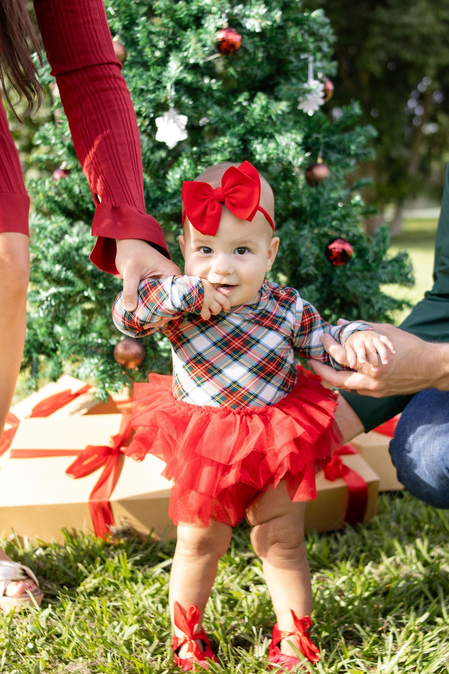 girl in red dress at Christmas photoshoot