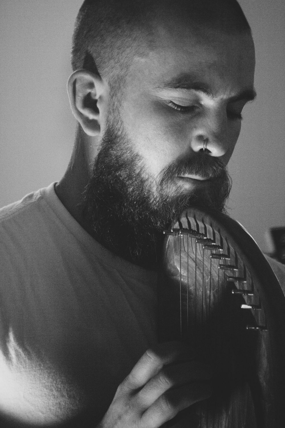 A series of black and white photos showing someone playing a harmonica in close-up profile view.
