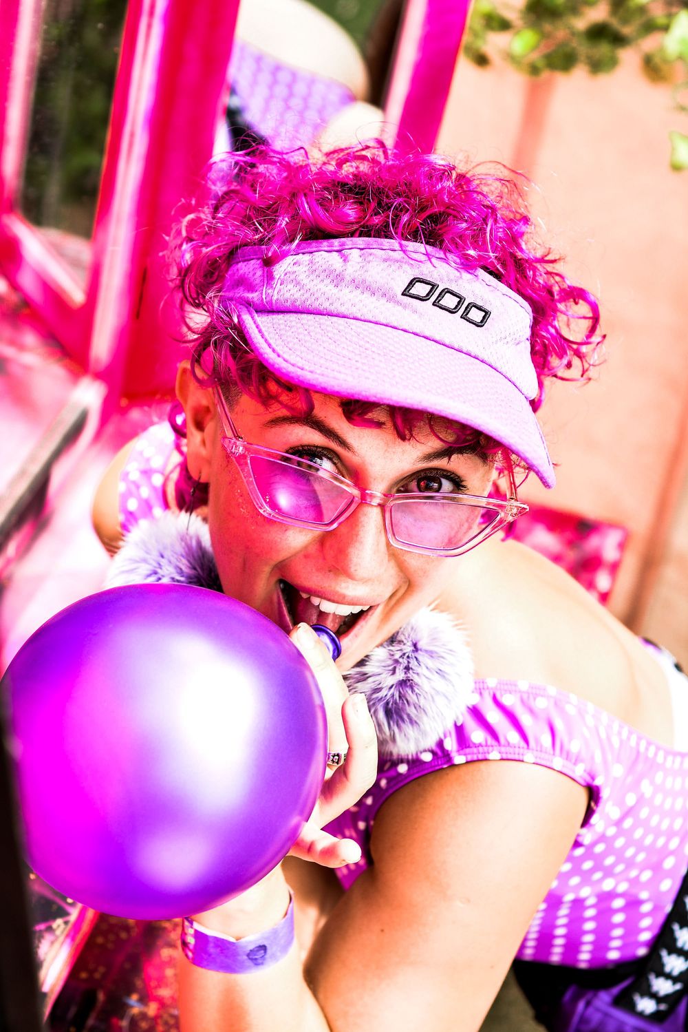 Vibrant pink and purple party scene with balloons and playful decorations creating a festive atmosphere.