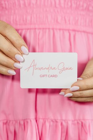 Luxury Alexandra Gioia gift card styled in pink branding setup for permanent jewelry boutique in Jupiter Florida studio.