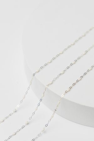 Silver beaded jewelry chain photographed in clean luxury studio setup for jewelry brand in Jupiter Florida.