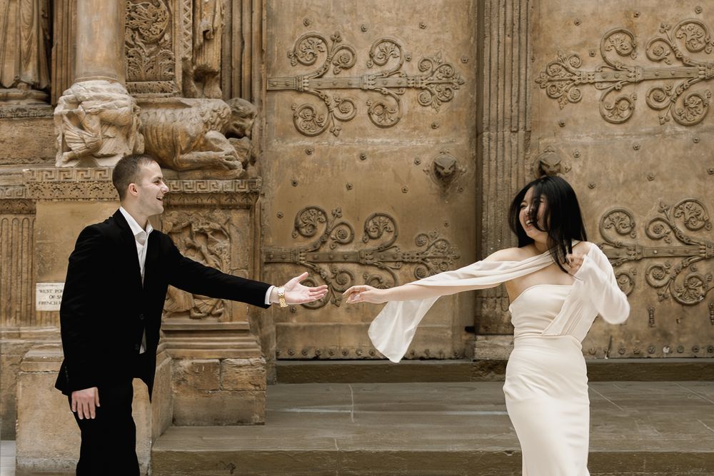A collage of wedding photos showing romantic moments between a couple against an ornate stone building backdrop.