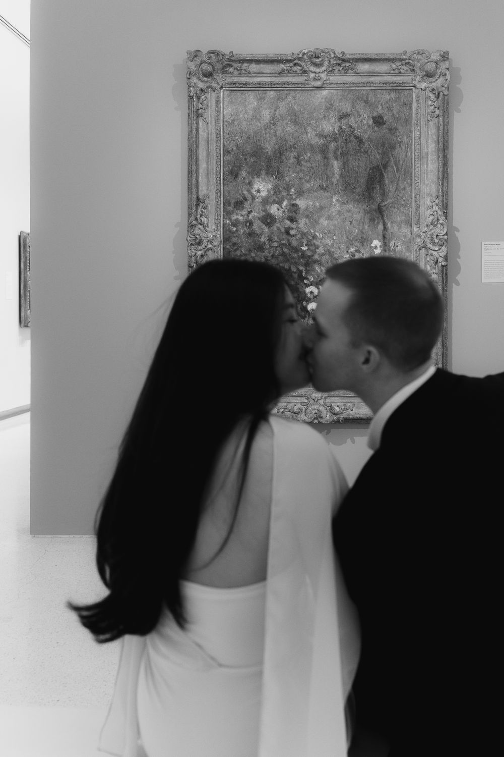 A sequence of romantic wedding photos showing a couple in black and white sharing intimate moments against an ornate wall.