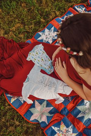 Artistic shots featuring a colorful patchwork quilt with star patterns laid on grass.