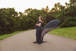 Sunset photoshoot sequence on a curved pathway surrounded by greenery.