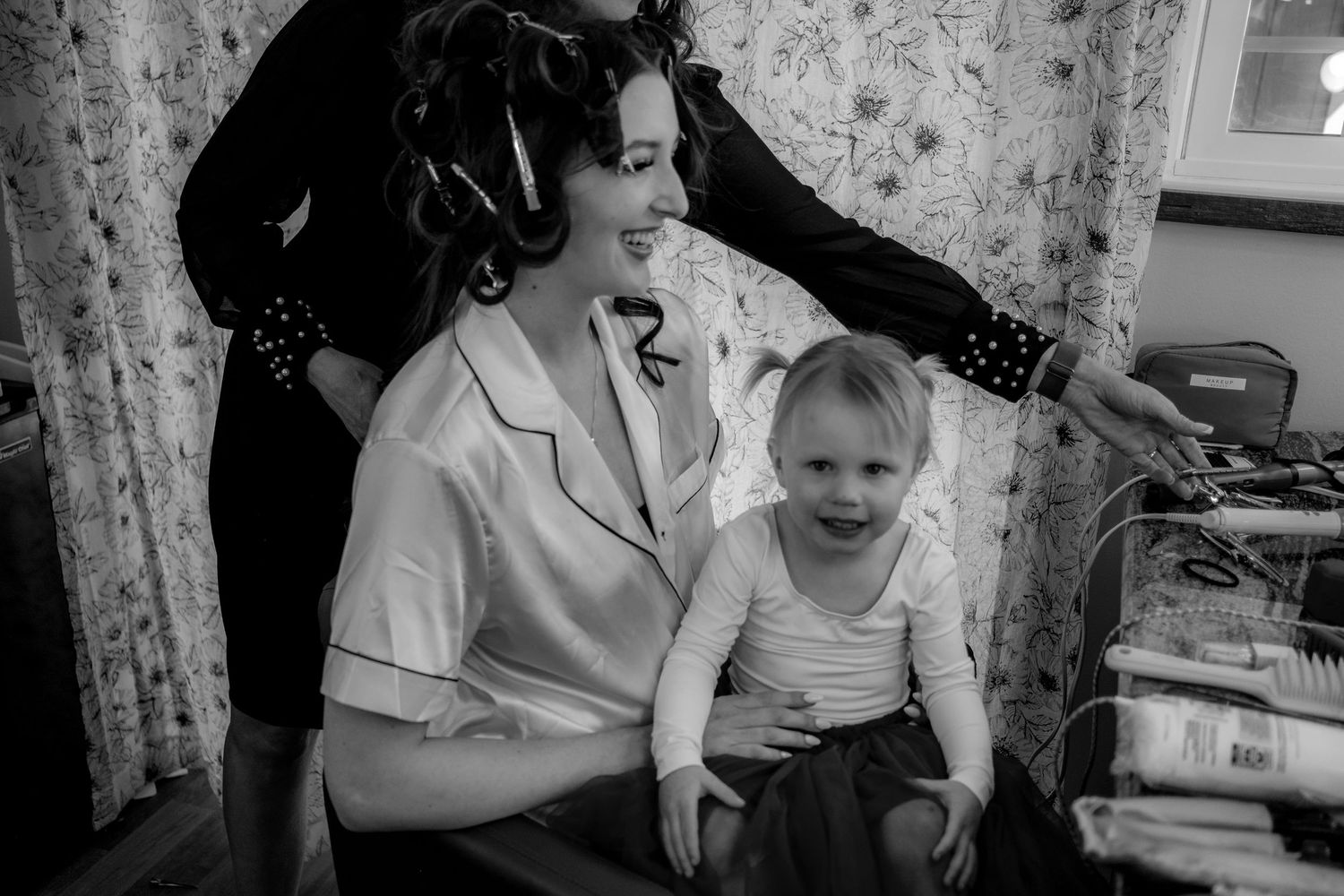 Black and white vintage photograph in a domestic interior setting.