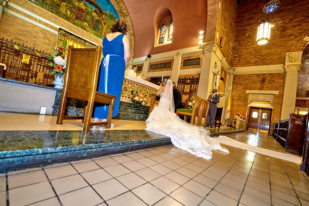 A dramatic moment captured in an ornate church interior with flowing wedding dress movement.