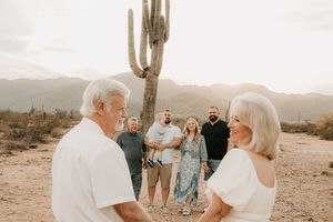 Family standing together beneath glowing desert skies in Arizona.
