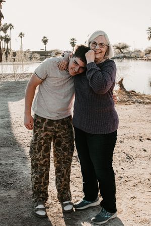 Family smiling together during a sunset session in Phoenix Arizona.