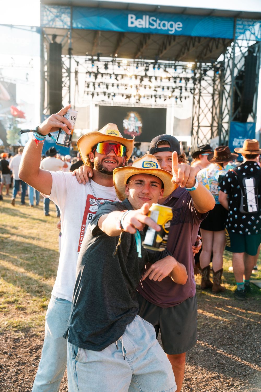 Three guys enjoying the music festival