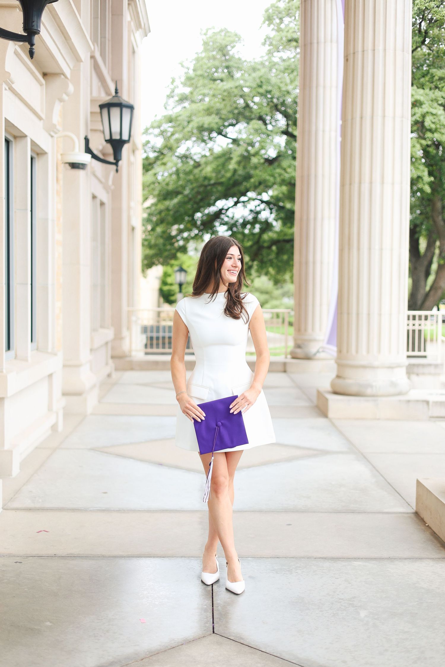 Elegant colonnade with white pillars creating architectural symmetry and depth.