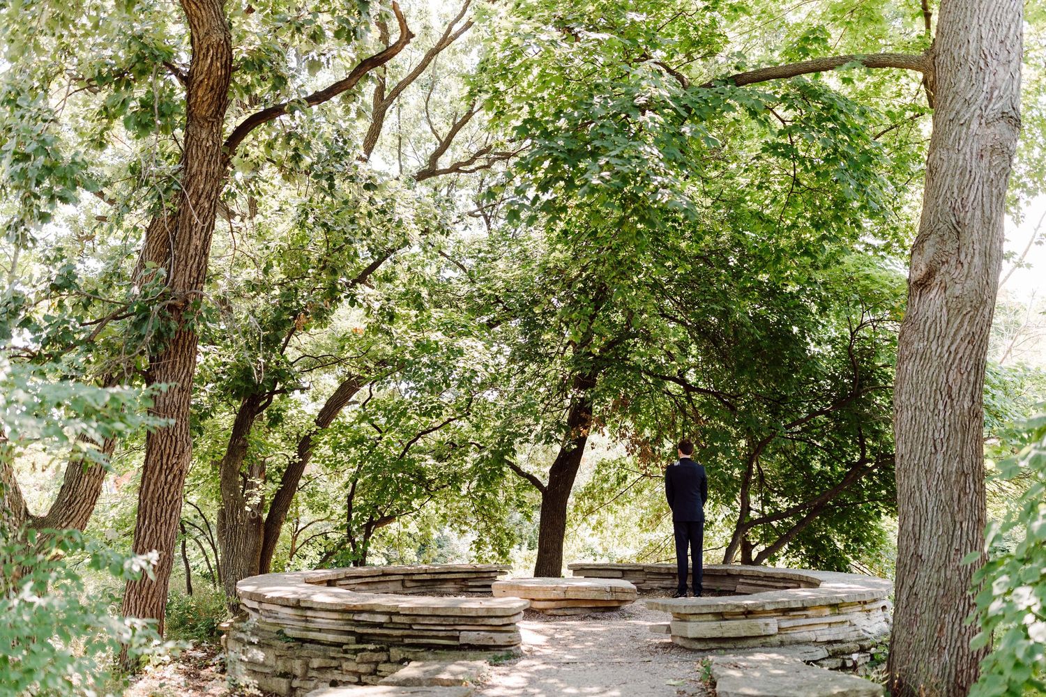 A serene tree-lined pathway in a garden wedding venue.