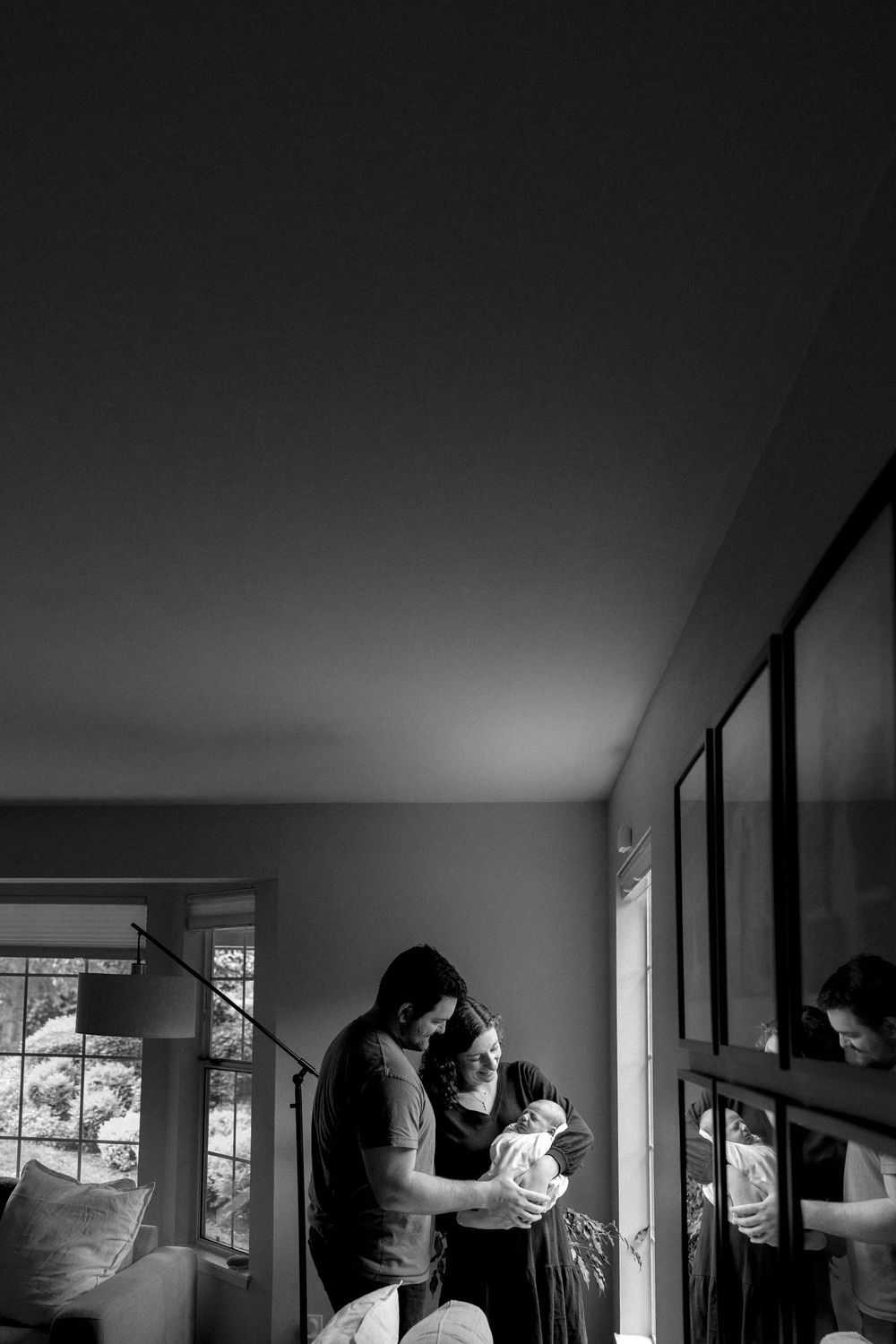 A black and white photo sequence shows someone moving through an interior space making artistic poses near windows.