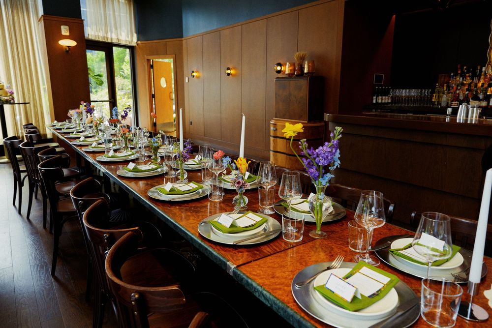 Elegant dining room setup with formal place settings and ambient lighting.