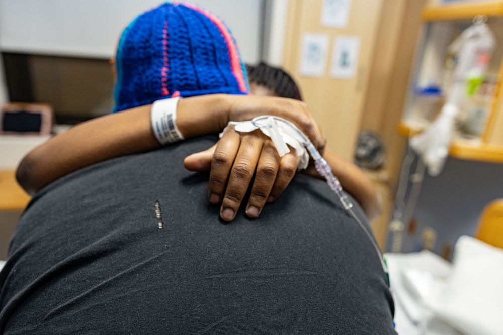 Close-up view of medical care being provided in a hospital setting.