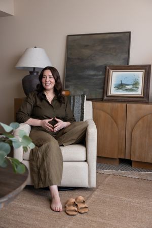 Woman business owner Talks Over Tea Mental Health Therapist in Tacoma, WA personal branding in client session talking with shoes off