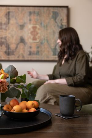 Woman business owner Talks Over Tea Mental Health Therapist in Tacoma, WA personal branding  talking to client in session