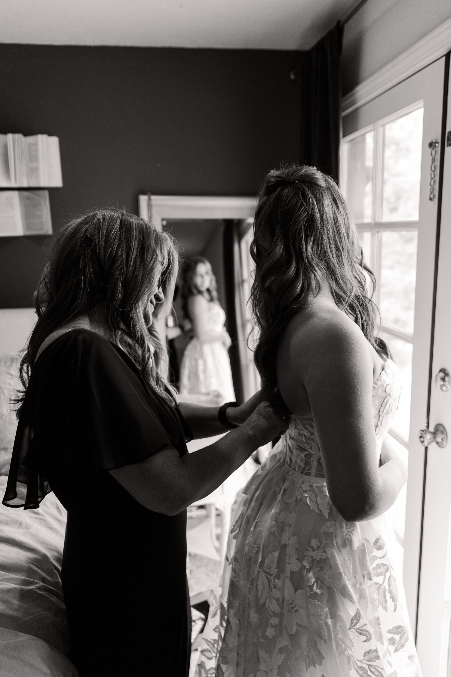 A series of black and white images showing wedding day preparations indoors.