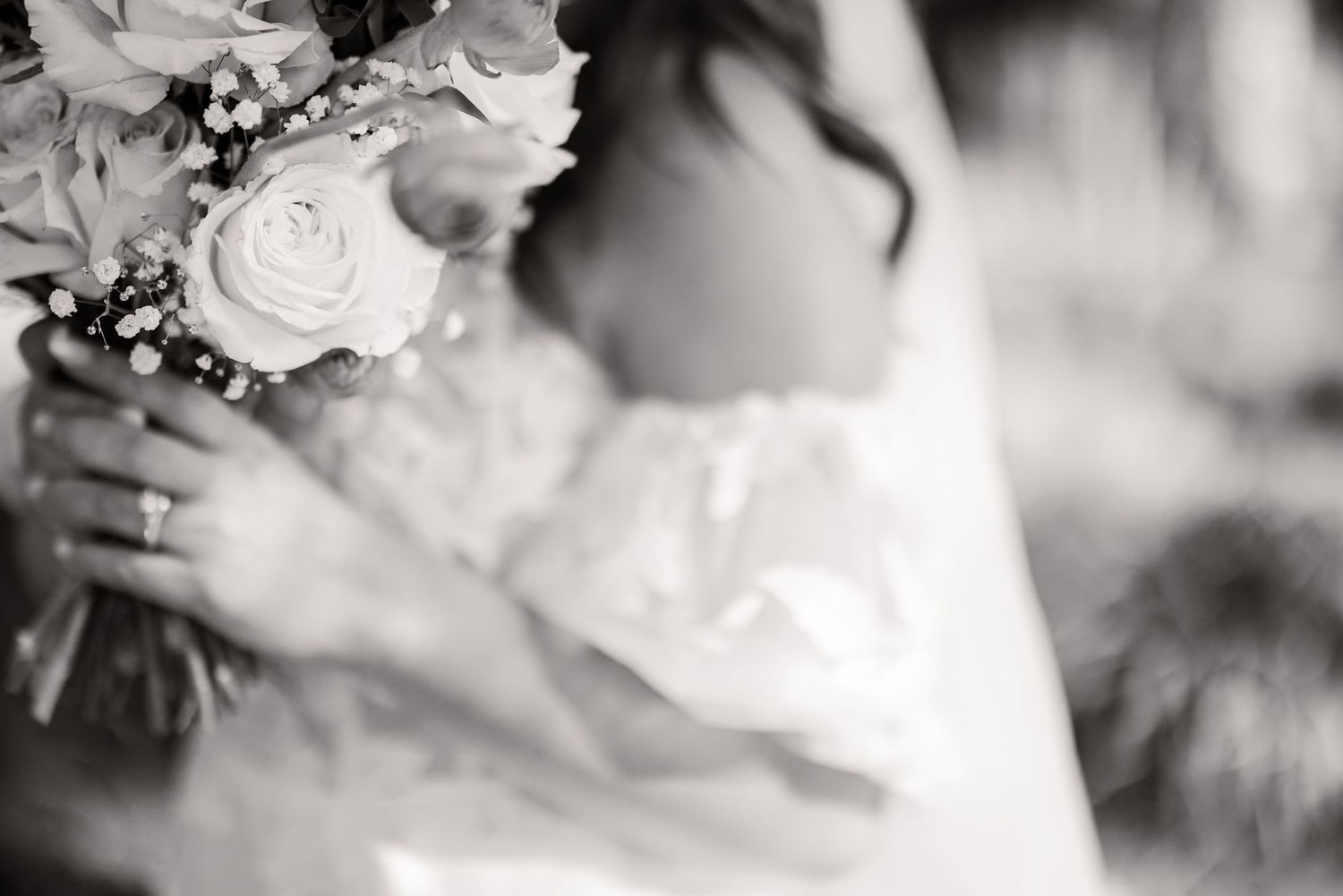Black and white wedding photo series capturing intimate moments between newlyweds.