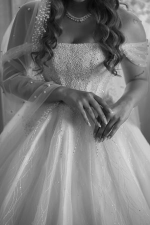 Detail shot of a sparkly wedding dress bodice with tulle skirt and crystal embellishments.