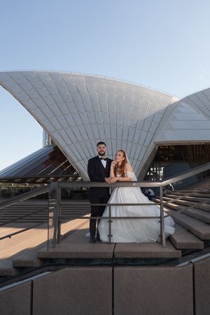 Wedding photography session with iconic Sydney Opera House white sails in background.