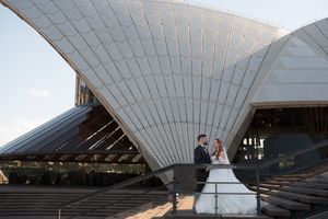 Wedding portrait session showcasing Sydney Opera House's distinctive white sail architecture.