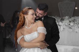 Intimate dance moment captured between newlyweds at their reception celebration.