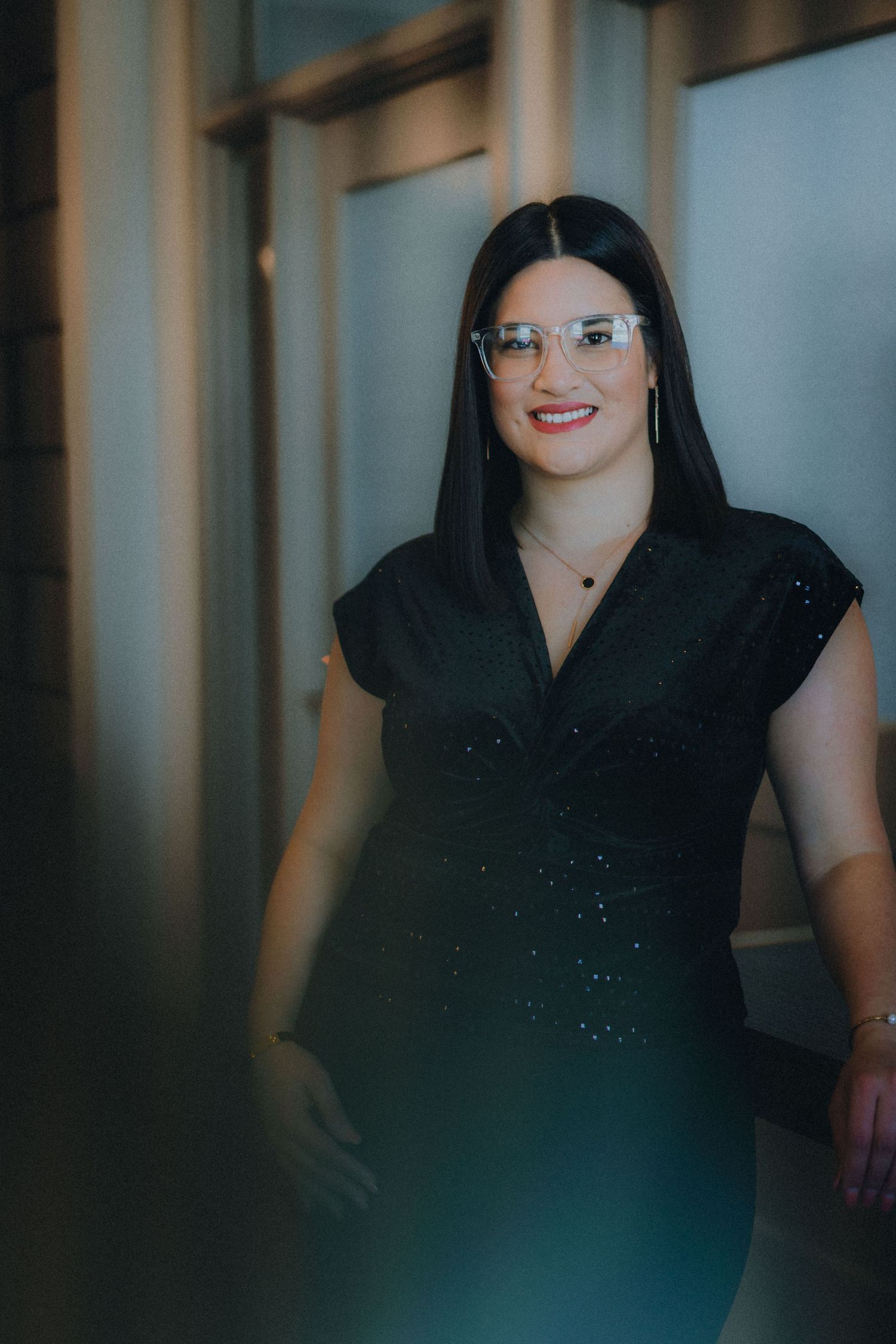 A candid series of progressive portrait shots shows a person in a black top with elegant lighting.