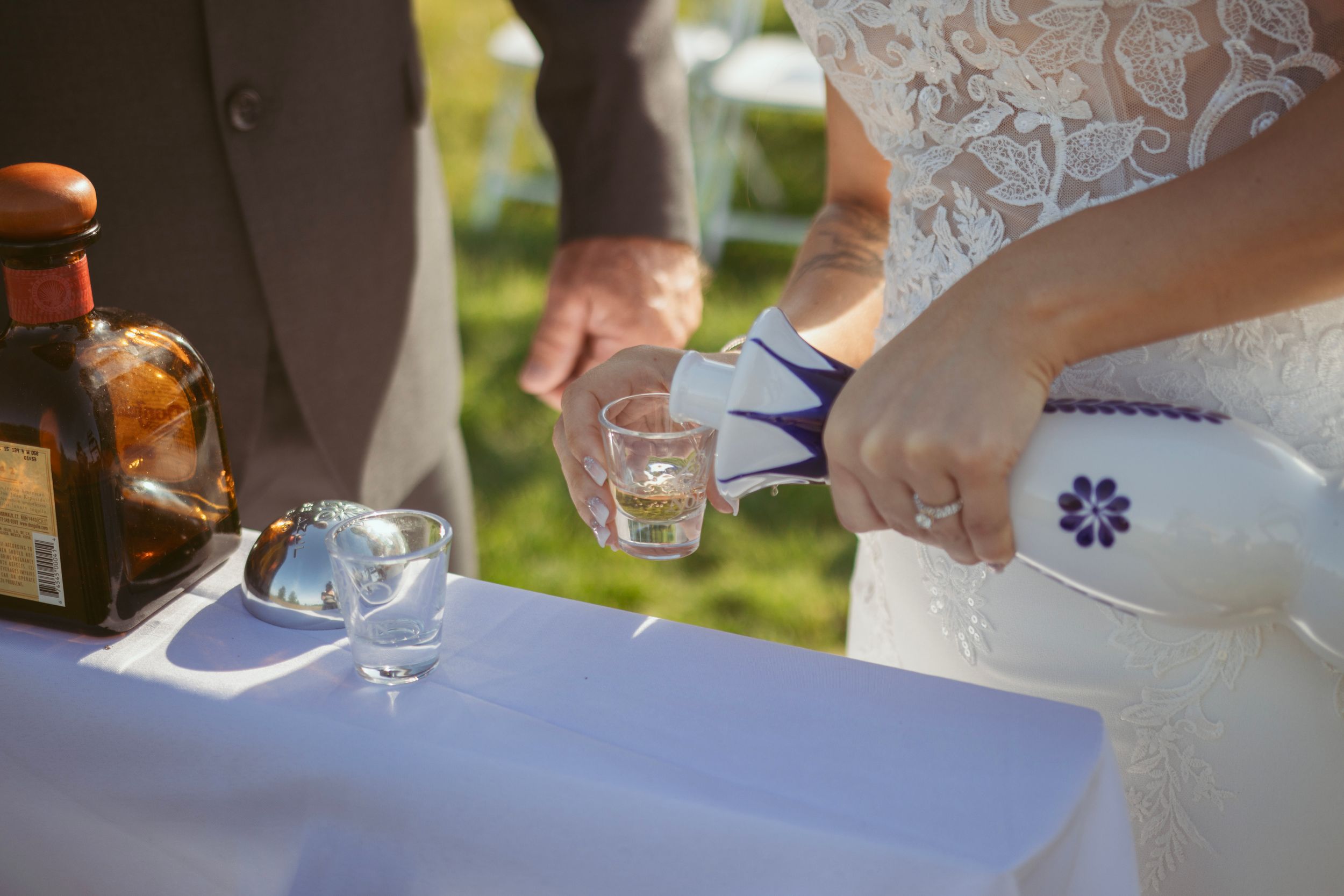 Close-up of champagne being poured into wedding glasses during the reception toast.