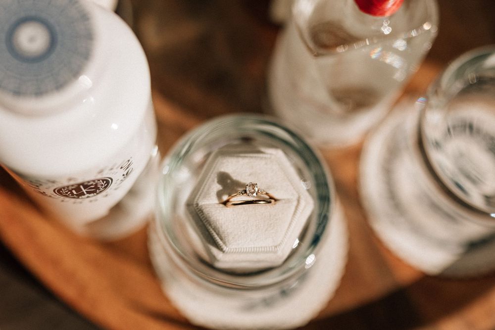 Wedding ring stacked on vintage glassware