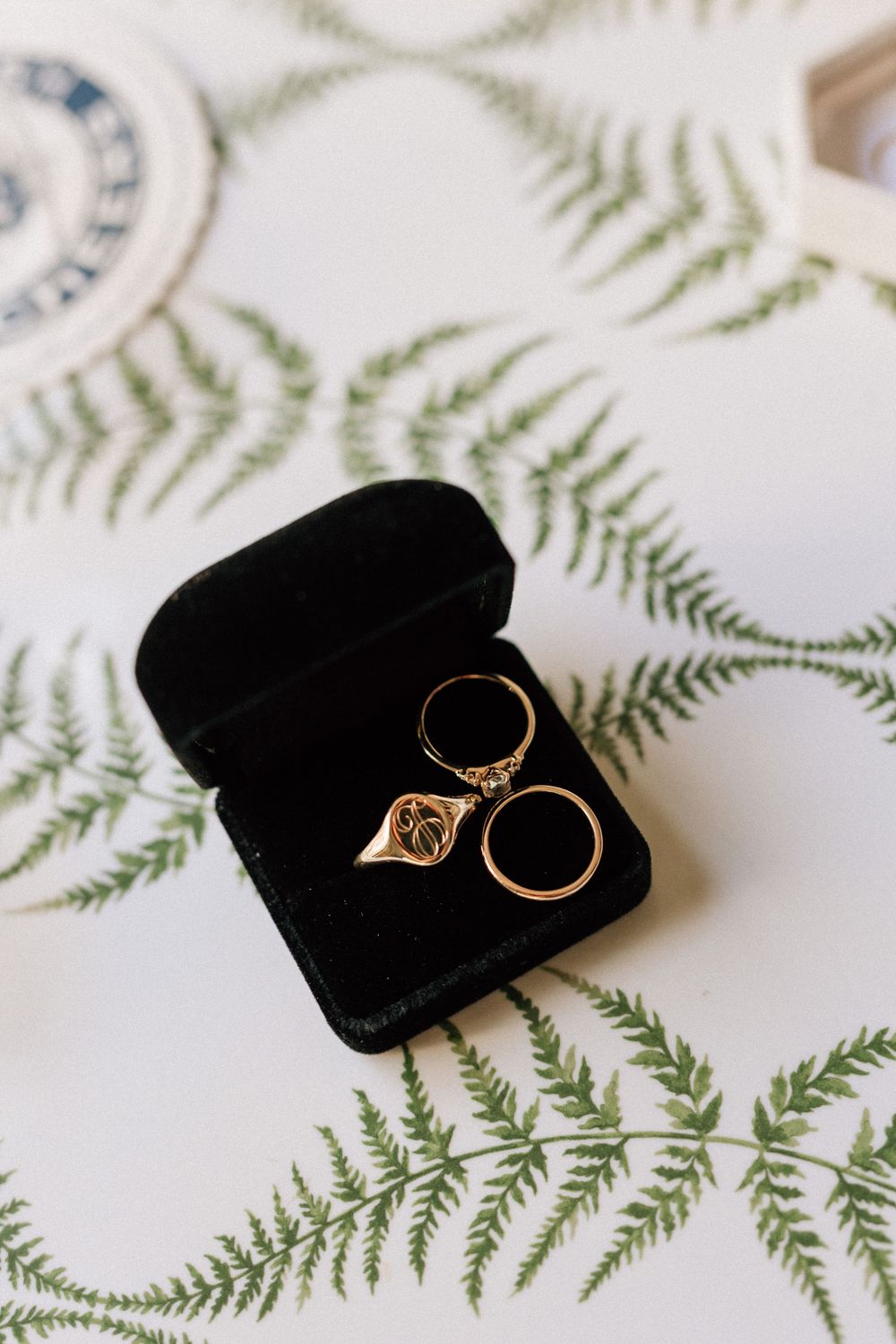 Macro photography of wedding rings in a black velvet box