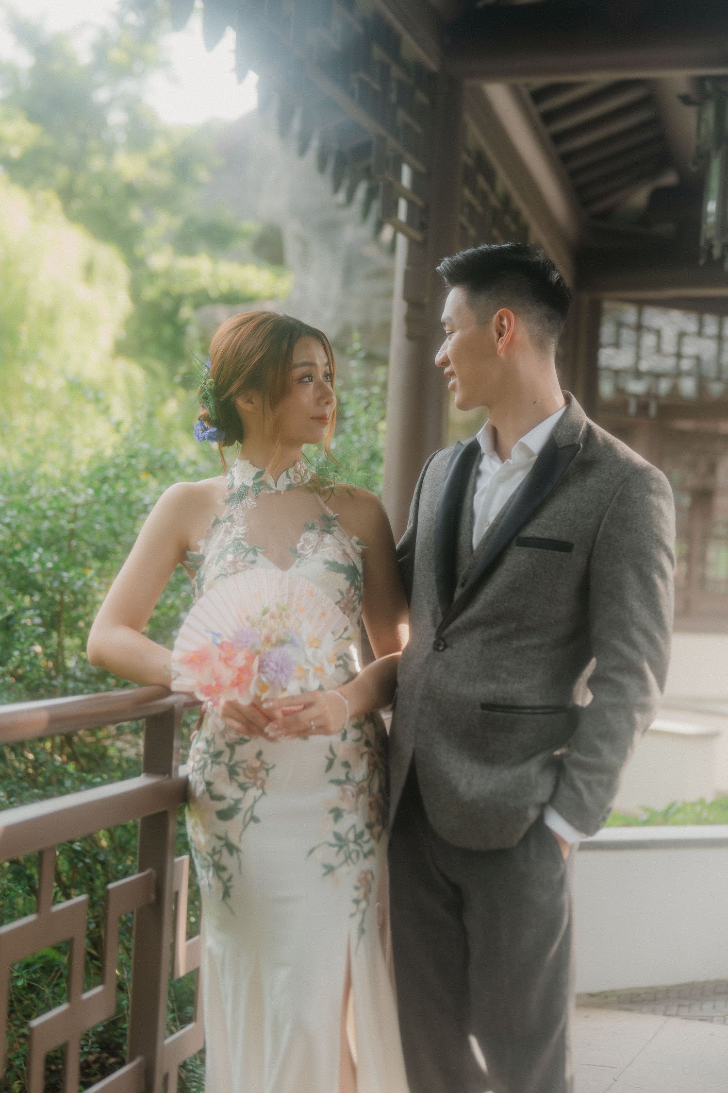 A collection of romantic wedding photos showing a couple in traditional attire posing along a covered walkway.
